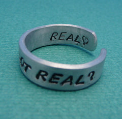 Hunger Games Inspired - Real Or Not Real. Real - A Double Sided Hand Stamped Aluminum Ring