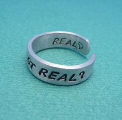 Hunger Games Inspired - Real Or Not Real. Real - A Double Sided Hand Stamped Aluminum Ring