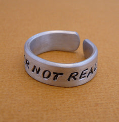 Hunger Games Inspired - Real Or Not Real - A Hand Stamped Aluminum Ring