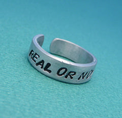 Hunger Games Inspired - Real Or Not Real. Real - A Double Sided Hand Stamped Aluminum Ring