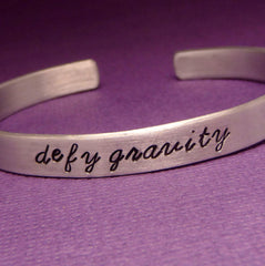 Wicked Inspired - Defy Gravity - A Hand Stamped Bracelet in Aluminum or Sterling Silver